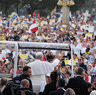 Crowds stretched the length of the Champs-Elysees in Paris as Pope Leo urged Catholics to find happiness in faith, not material things, at the biggest event of his visit to France, an outdoor Mass with an estimated 800,000 people.