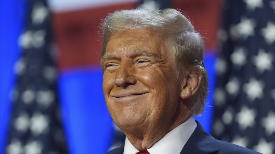 Donald Trump smiles at an election night watch party at the Palm Beach Convention Centre in the early hours of Wednesday.