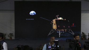 Animated graphics of Chandrayaan-2 landing module are displayed on a screen at a media centre set up to celebrate the landing, but it disappointed.