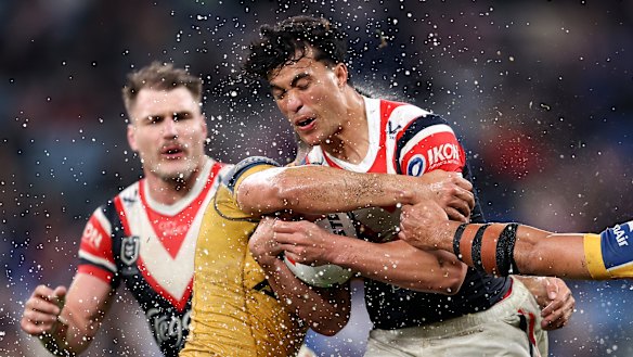 Rugby convert Joseph Suaalii battles the Eels’ defence for the Roosters.