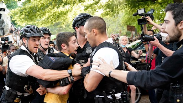 Uniformed US Secret Service police detain a protester in Lafayette Park across from the White House in the wake of George Floyd's death.