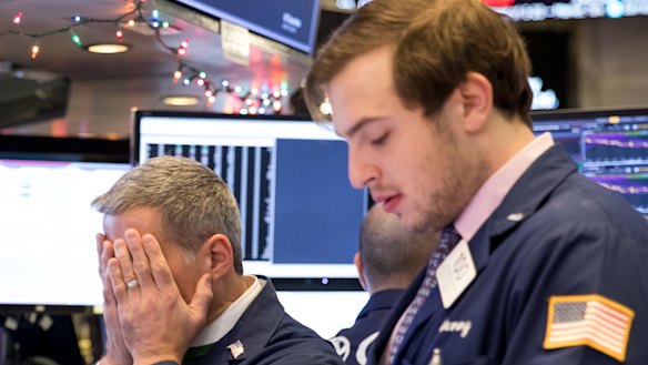 'Boom, we puke': Traders on the floor of the New York Stock Exchange.