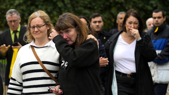 Members of the public react after leaving Westminster Hall.
