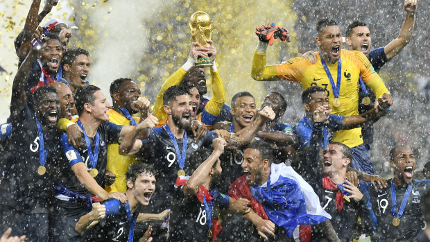 Long way to fall: Hugo Lloris lifts the World Cup trophy in July.