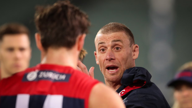 Dee-monstrative: Melbourne coach Simon Goodwin during Sunday night's 57-point win over the Kangaroos.