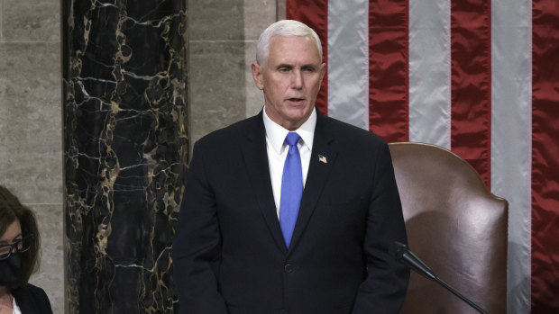 Vice-President Mike Pence reads the final certification of Electoral College votes on the night of the riots. 