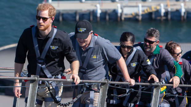 Prince Harry, Prime Minister Scott Morrison, and some Invictus Games competitors scale the Sydney Harbour Bridge.