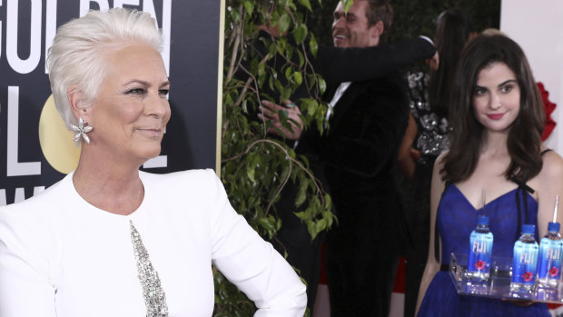 Jamie Lee Curtis is not impressed with Fiji Water Girl, aka Kelleth Cuthbert, photobombing her at the Golden Globe Awards on Sunday in LA.