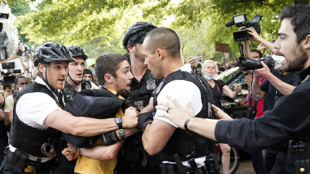 Uniformed US Secret Service police detain a protester in Lafayette Park across from the White House in the wake of George Floyd's death.
