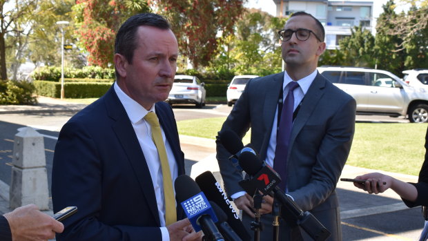 Premier Mark McGowan speaks at a media conference alongside his communications director Daniel Pastorelli.