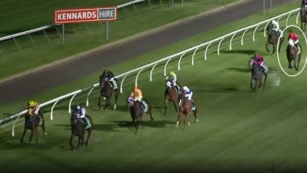 Incentivise (circled, red cap and sleeves) trails home well behind winner Golden Goal (purple cap) with 150 metres to go in the March race in Toowoomba.