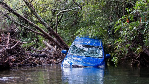 The man's body was found under his semi-submerged Holden Colorado on Monday morning.