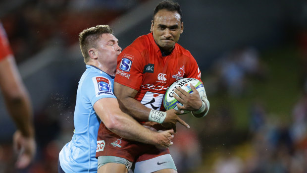 Strong-arm tactics: Semisi Masirewa scored a hat-trick as the Waratahs' defence withered under pressure. 