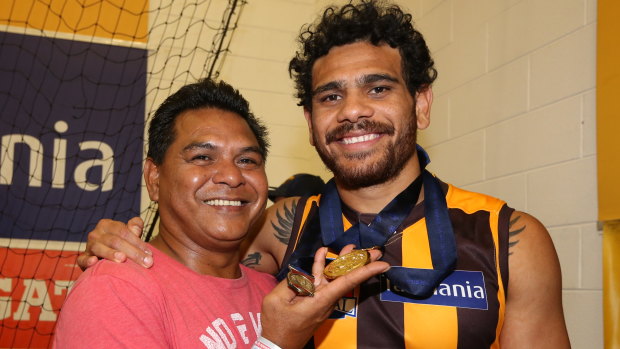 Special memories: Cyril Rioli celebrates with his Dad after the 2015 premiership.