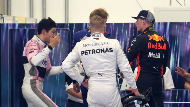 Clash: Red Bull's Max Verstappen confronts Esteban Ocon (left) in the weigh-in room.