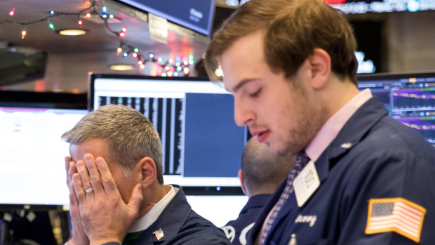 'Boom, we puke': Traders on the floor of the New York Stock Exchange.