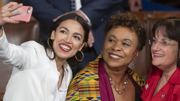 Alexandria Ocasio-Cortez, a freshman Democrat representing New York's 14th Congressional District, takes a selfie with Representative Ann McLane Kuster and Representative Barbara Lee on the first day of the 116th Congress with Democrats holding the majority, at the Capitol in Washington on Thursday.