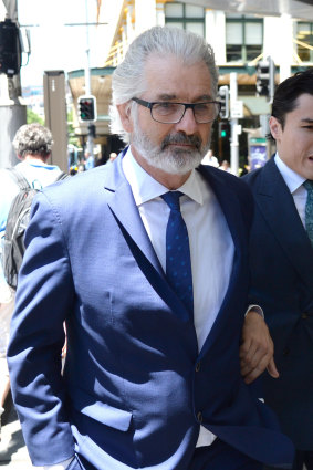 John Jarratt leaves the Downing Centre District Court in December 2018.