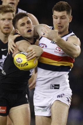 Former teammates Marc Murphy (left) and Bryce Gibbs battle for the ball at Etihad Stadium.