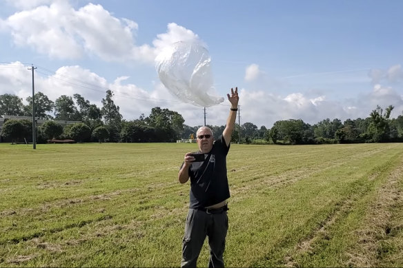 Ed Harrison launches a balloon in a field near Collierville, Tennessee. 