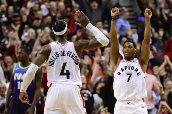 Kyle Lowry and Rondae Hollis-Jefferson celebrate their comeback win.