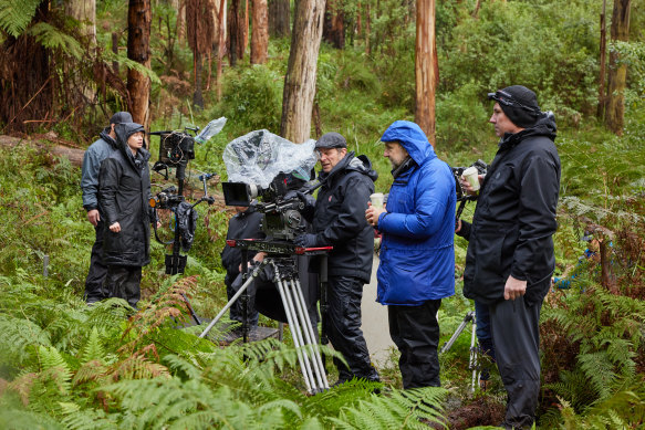Behind the scenes of Force of Nature: The Dry 2. Director Robert Connolly is in the bright blue rain jacket.