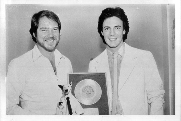 Robbie Porter presents Rick Springfield with his gold record of Jessie’s Girl, November 15, 1981. 
