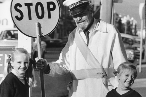 School crossing supervisor Theo Miller on Burwood Road in Hawthorn, 1979.