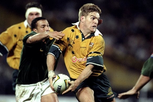 Tim Horan vestindo a famosa camisa Reebok Wallabies em 1999.