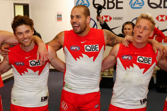 Dane Rampe, Lance Franklin, and Isaac Heeney sing the famous Sydney song.