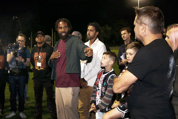 Heritier Lumumba with Nicky Winmar (right).