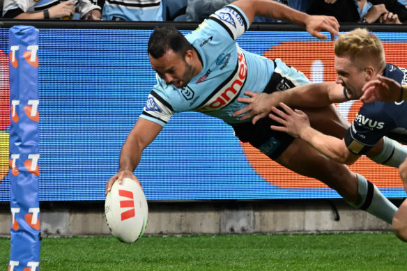 Shark to Superman: Braydon Trindall makes a spectacular dive for the tryline.