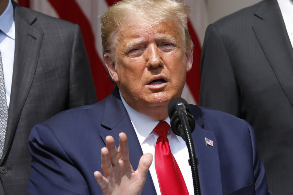 President Donald Trump talks up the US employment figures in the Rose Garden of the White House on Friday.