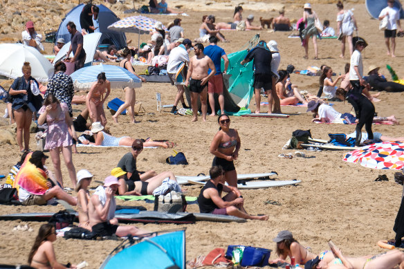 People at Torquay enjoy the summer sunshine on Saturday.