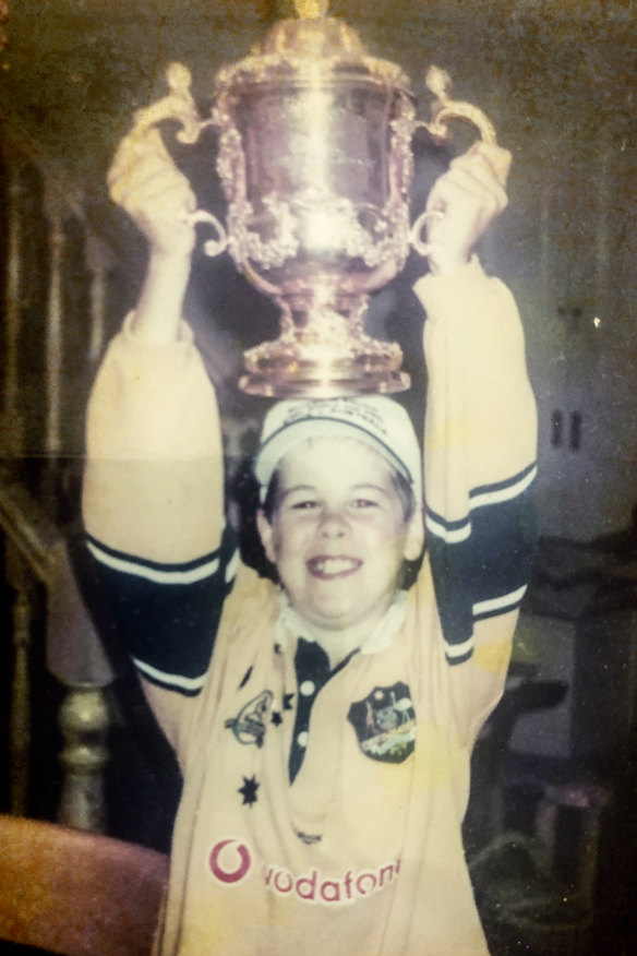 Harry O'Neill, 10, poses with the damaged Webb Ellis Cup on November 9 in Sydney