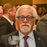 Neil Mitchell flanked by the prime minister and opposition leader at his testimonial lunch