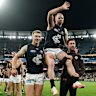 Carlton’s Sam Docherty is chaired off the ground after his final game.