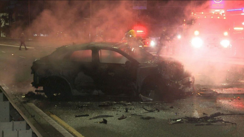 Manhunt under way after fiery crash leaves man critical