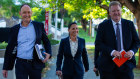 Northern Minerals managing director Shane Hartwig (left), chief operating officer Angela Glover and executive chairman Adam Handley arrive at the AGM in West Perth on Thursday.