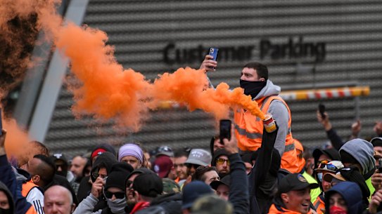Protesters set off flares in the city on Tuesday in the second day of demonstrations.