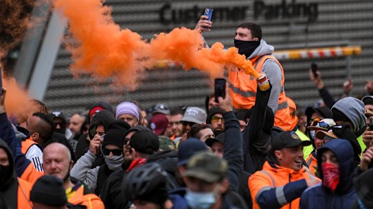 Protesters set off flares in the city on Tuesday in the second day of demonstrations.