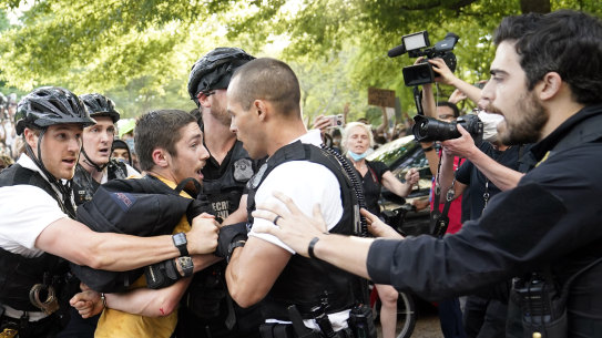 Uniformed US Secret Service police detain a protester in Lafayette Park across from the White House in the wake of George Floyd's death.