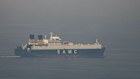 A cargo ship sails in the Arabian Gulf towards Strait of Hormuz on Sunday.