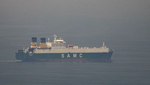 A cargo ship sails in the Arabian Gulf towards Strait of Hormuz on Sunday.