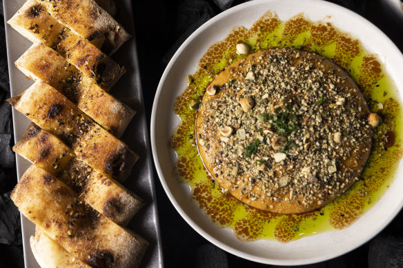 Woodfired flatbread with harissa pumpkin and lentil whip, hazelnuts and hemp seed dukkha.