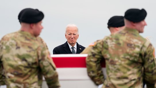 President Joe Biden stands as an Army carry team moves the transfer case containing the remains of US Army Sergeant Breonna Alexsondria Moffett, one of three killed in the attack in Jordan.