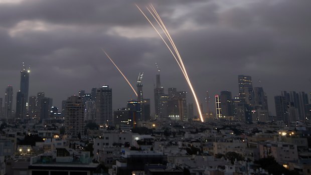 Israel’s Iron Dome air defence system fires to intercept projectiles over Tel Aviv on Saturday. Iran struck back after Israel launched its surprise attack a day earlier.