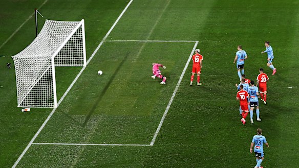Melbourne City's Harrison Delbridge shoots past Andrew Redmayne. It was ruled Lachlan Wales, centre, was in an offside position and was obstructing the view of Redmayne.