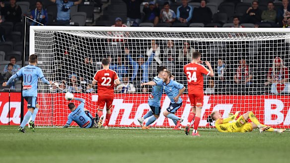 Match winner: Rhys Grant puts Sydney FC ahead in extra time of the A-League grand final.