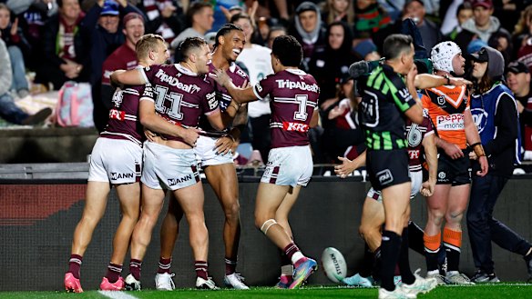 The Sea Eagles celebrate a Jason Saab try.